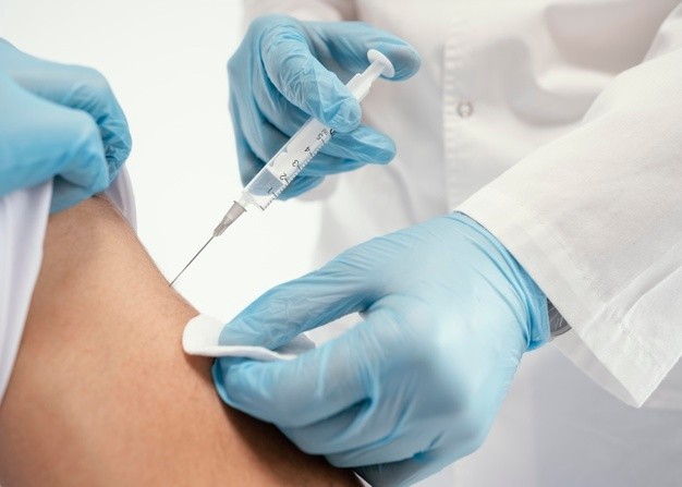 Doctor Vaccinating Patient Clinic 23 2148920148 1