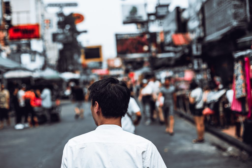 Back View Of Portrait Young Asian Man Walking On Khaosan Road, Bangkok.