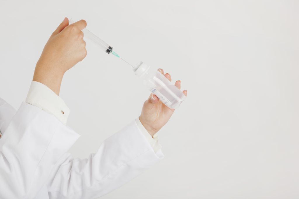 Doctor With Syringe Test Tube