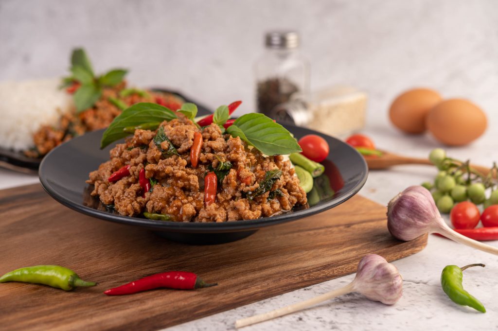 Spicy Minced Pork And Rice On A Black Plate.