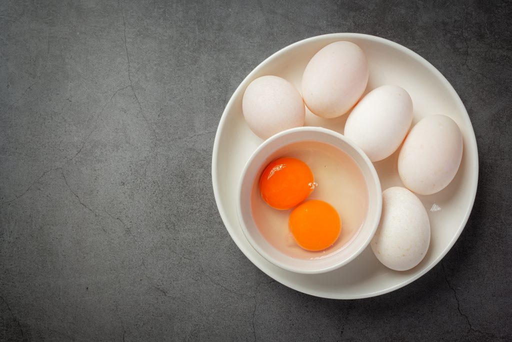 Duck Eggs On Dark Background